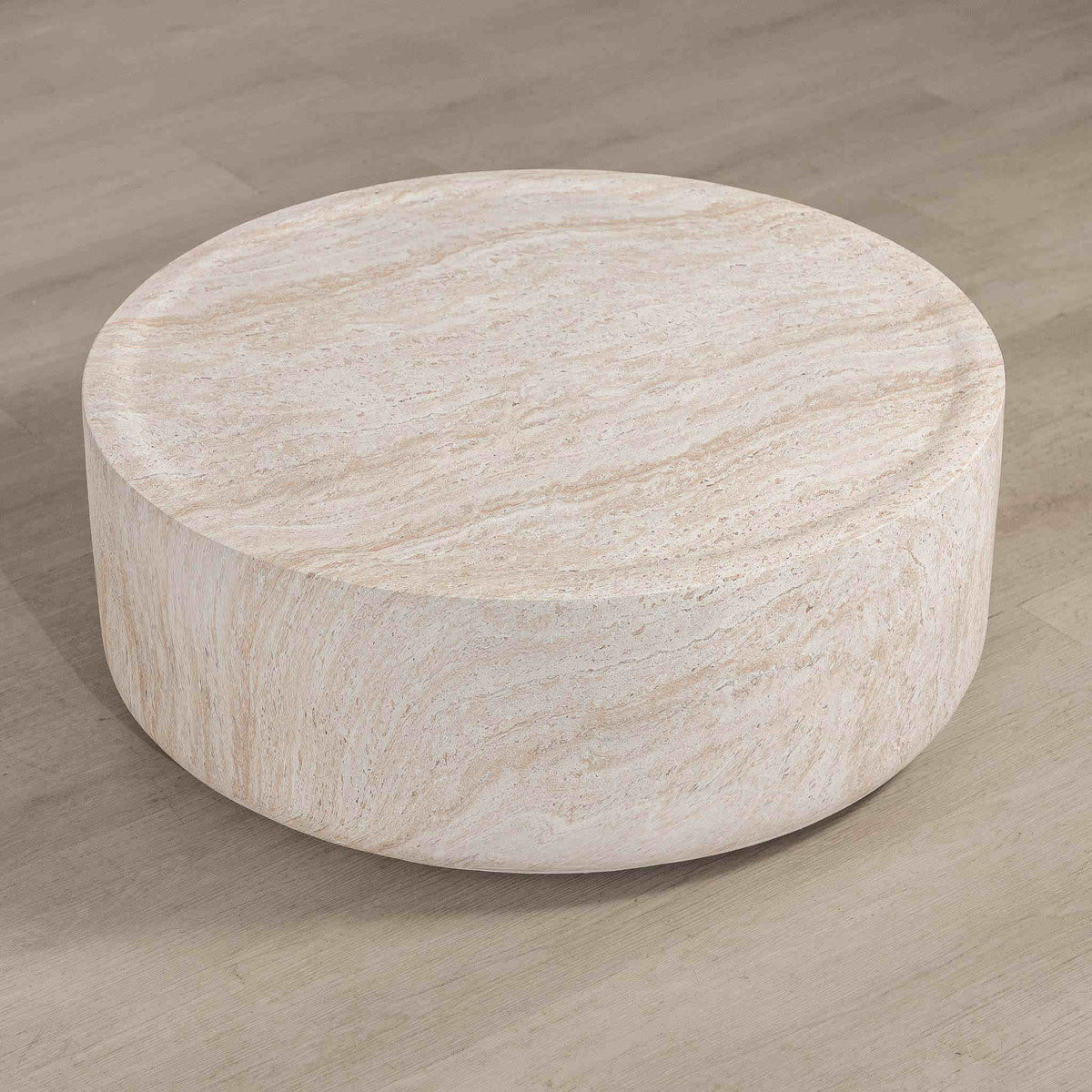 Gallery Everyday Cecilia Coffee Table in Seashell, featuring a round light beige travertine stone design in a bright modern living room.