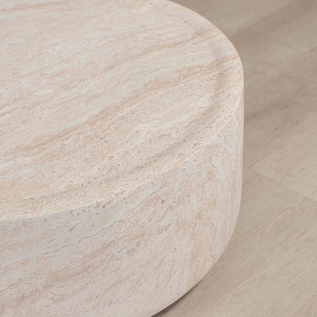 Gallery Everyday Cecilia Coffee Table in Seashell, featuring a round light beige travertine stone design in a bright modern living room.