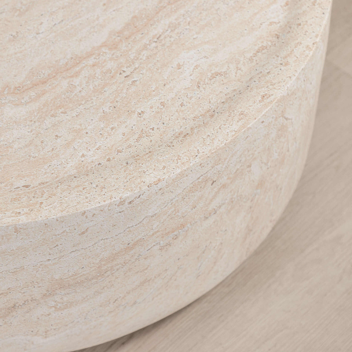 Gallery Everyday Cecilia Coffee Table in Seashell, featuring a round light beige travertine stone design in a bright modern living room.