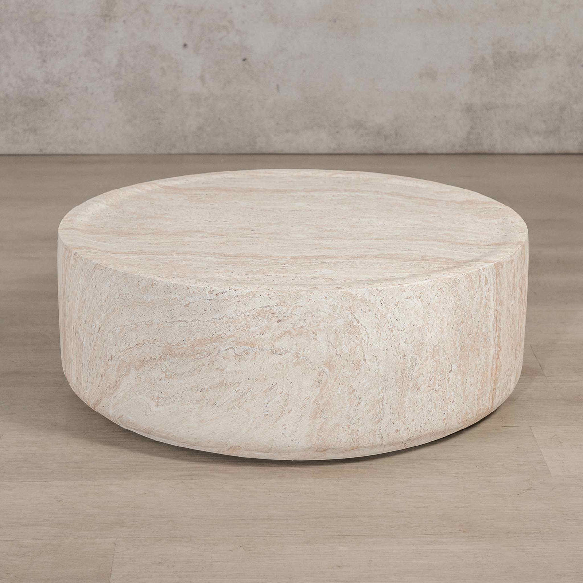 Gallery Everyday Cecilia Coffee Table in Seashell, featuring a round light beige travertine stone design in a bright modern living room.