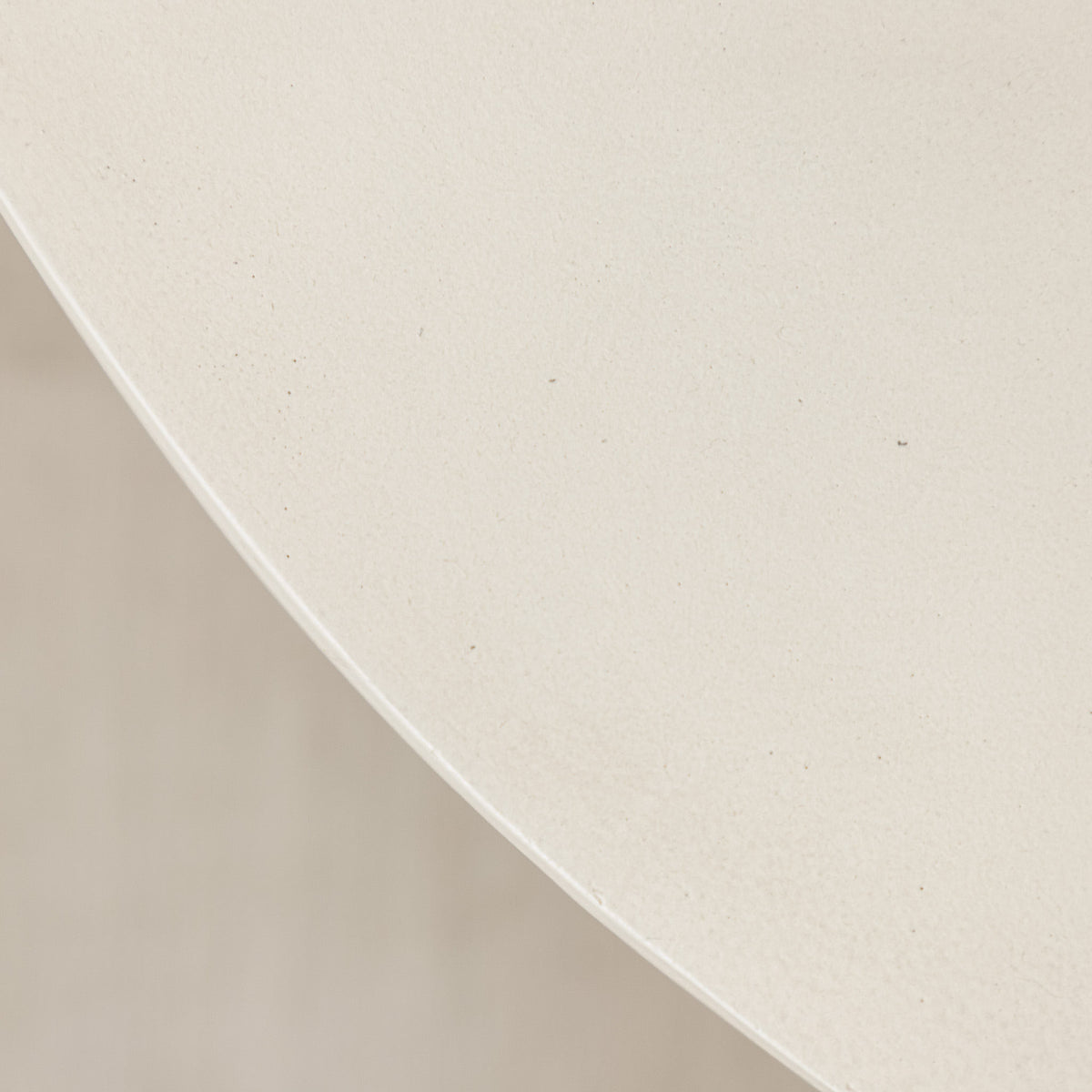 Gallery Everyday Corsano Coffee Table, featuring a round low-profile design in a warm off-white concrete finish.