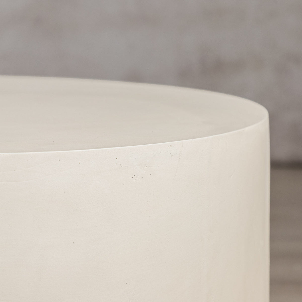 Gallery Everyday Corsano Coffee Table, featuring a round low-profile design in a warm off-white concrete finish.