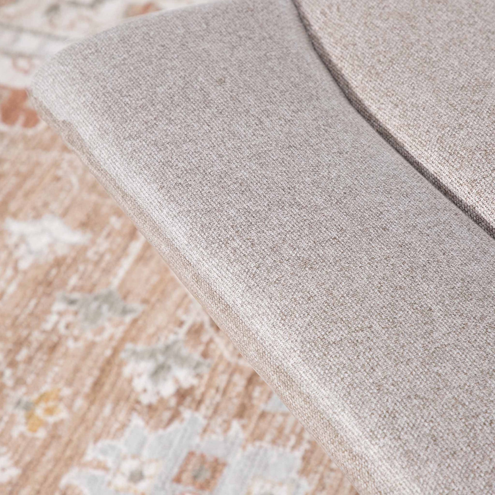 Close-up of the Leather Gallery Dallas Fabric Rocker Recliner Chair in Beige, showing the textured upholstery and curved armrest.