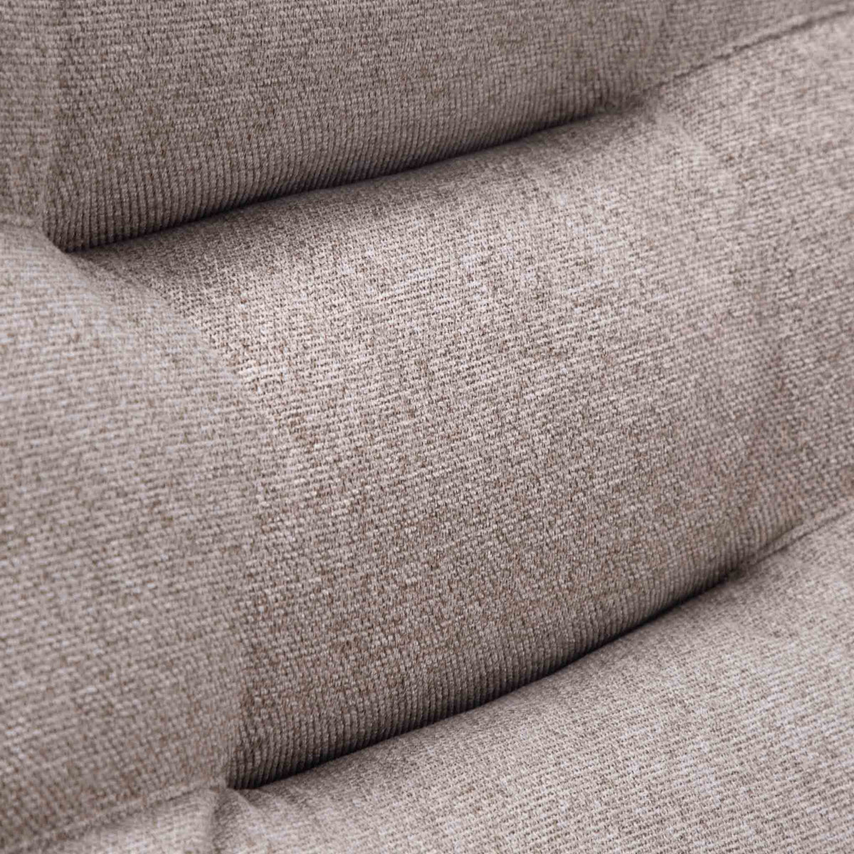 Close-up of the Leather Gallery Dallas Fabric Rocker Recliner Chair in Beige, showing the textured woven fabric and tufted cushion seams.