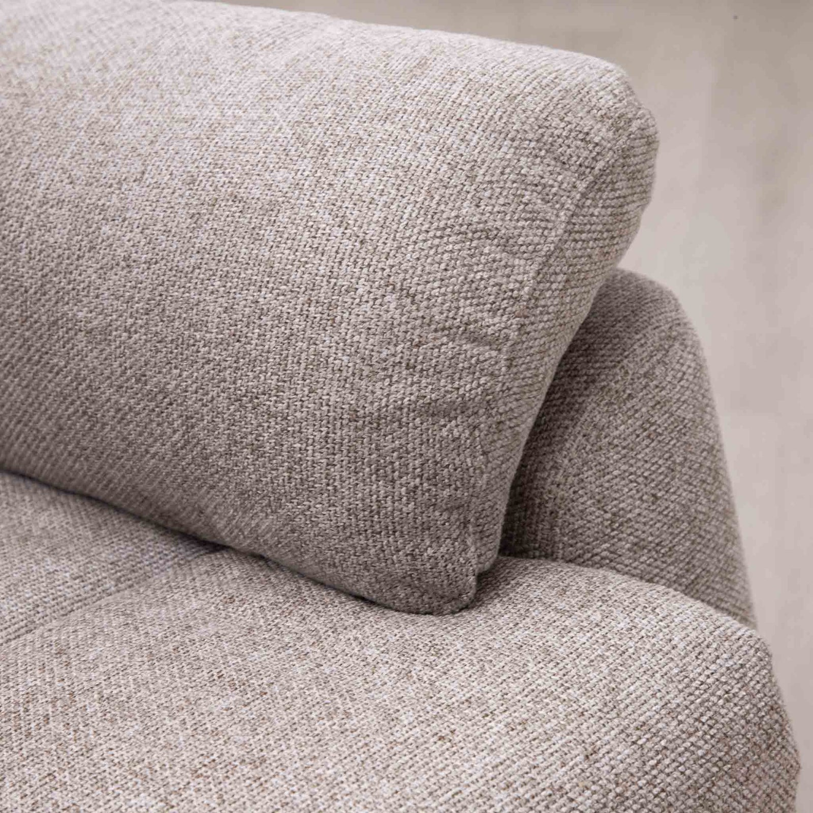 Close-up of the Leather Gallery Dallas Fabric Rocker Recliner Chair in Beige, showing the textured woven fabric and visible stitching detail.
