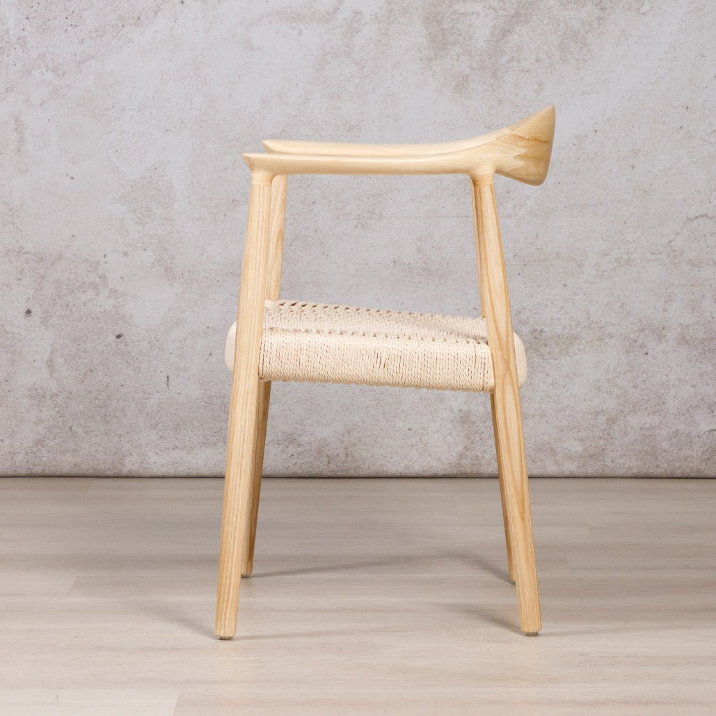 Easton wood dining chair featuring a natural ash wood frame and a textured, handwoven rope seat. dining chairs, modern dining chairs, armchairs