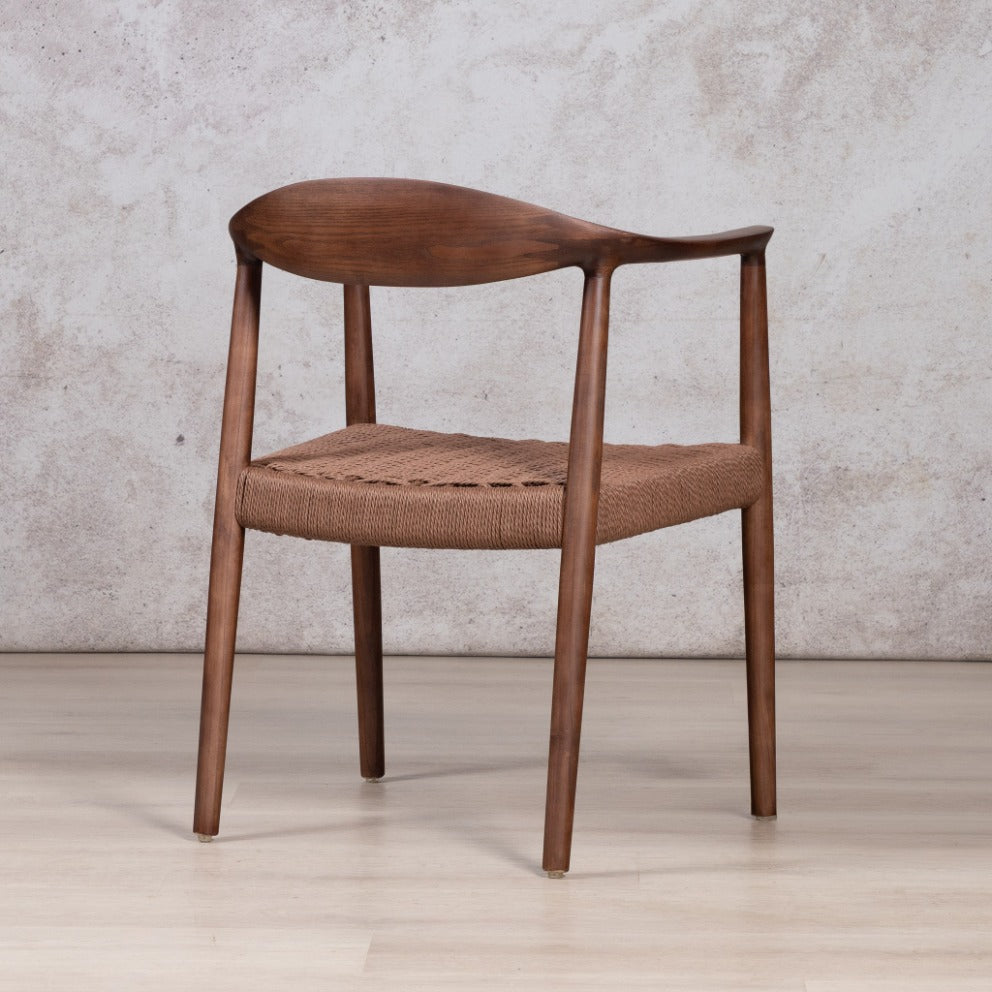 Easton wood dining chair featuring a walnut wood frame and a textured, handwoven rope seat. dining chairs, modern dining chairs, armchairs