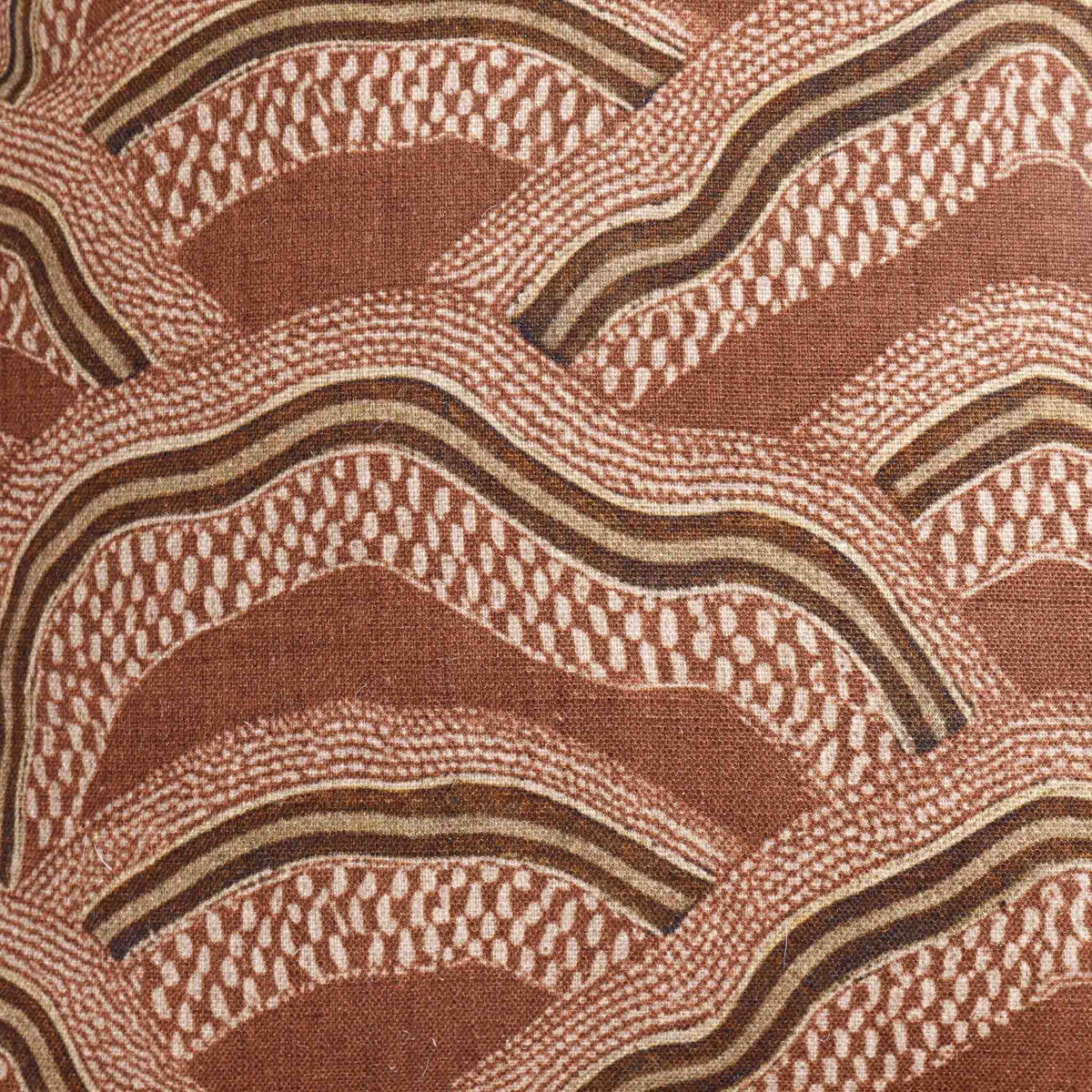 Leather Gallery Ember Terrain Cushion in Seal Brown, featuring a rust-brown and beige wavy geometric pattern.