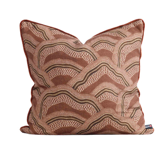 Leather Gallery Ember Terrain Cushion in Seal Brown, featuring a rust-brown and beige wavy geometric pattern.