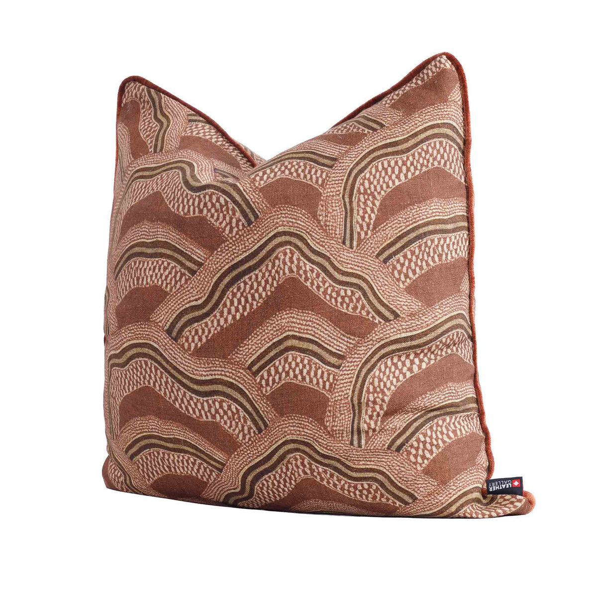 Leather Gallery Ember Terrain Cushion in Seal Brown, featuring a rust-brown and beige wavy geometric pattern.