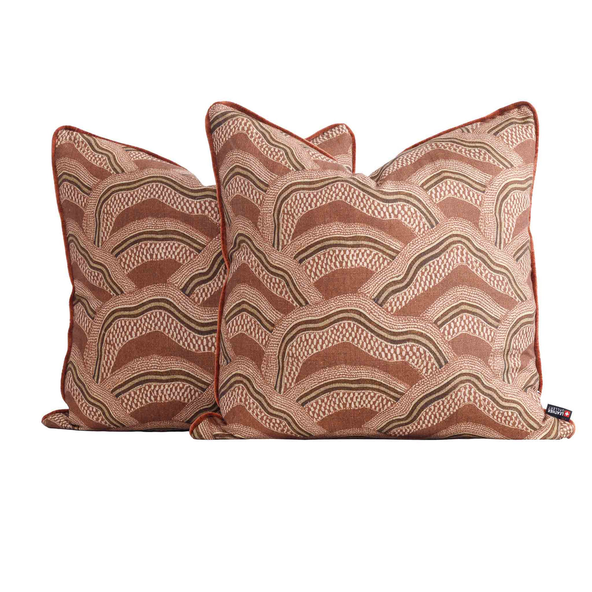Two Leather Gallery Ember Terrain Cushions in Seal Brown, featuring a rust-brown and beige wavy geometric pattern.