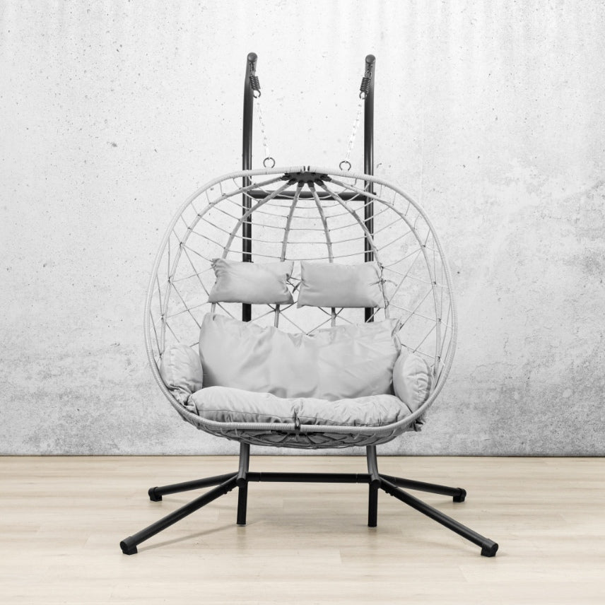 Spacious two-seater Emerson Hanging Egg Chair in grey, shown in a luxurious outdoor space. | Outdoor chairs, patio chairs for sale, hanging chair, egg chairs