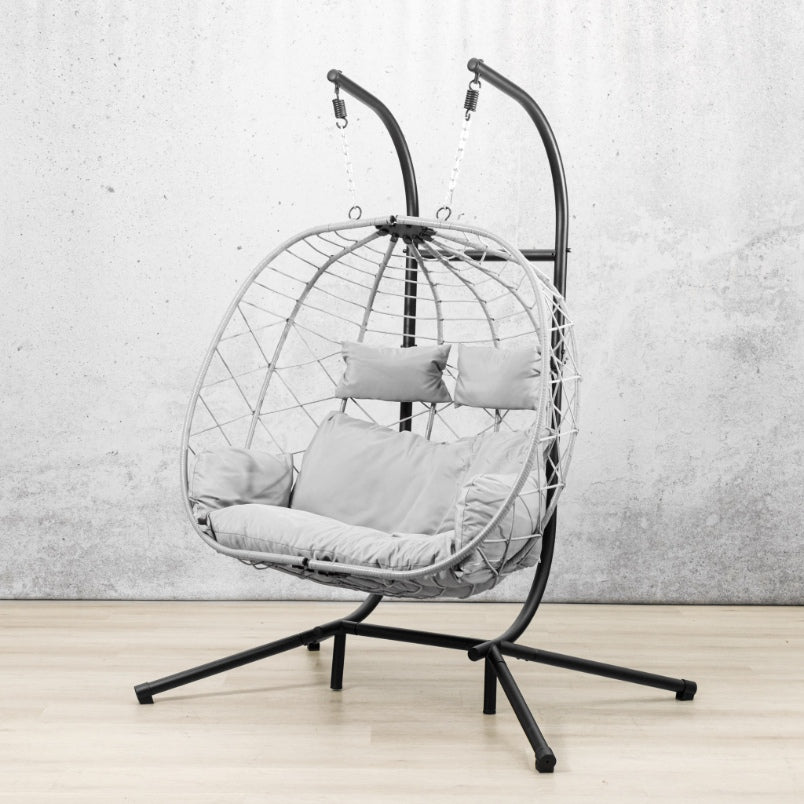 Spacious two-seater Emerson Hanging Egg Chair in grey, shown in a luxurious outdoor space. | Outdoor chairs, patio chairs for sale, hanging chair, egg chairs 