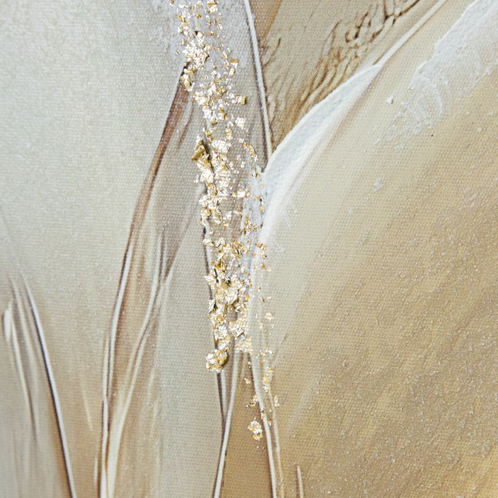 Close-up of gold leaf flake texture on the beige and white background of Fern Soliloquy canvas. Elegant wall decor detail and wall art for contemporary living interiors.