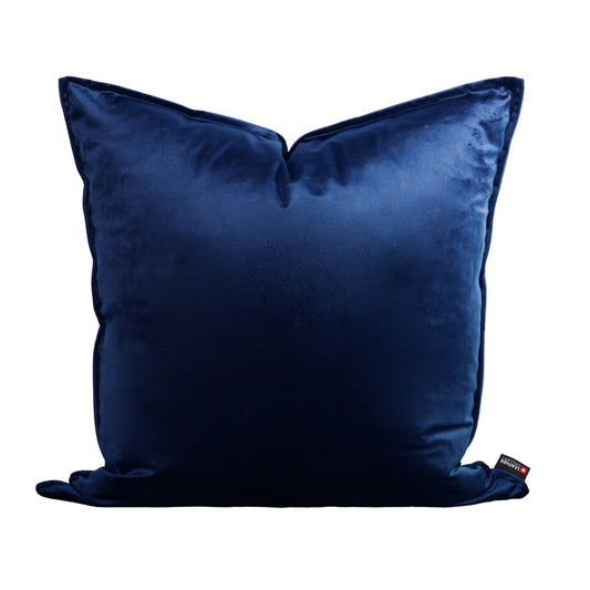 Leather Gallery Fluxx Navy Blue Cushion 59cm x 59cm, featuring soft velvet upholstery and a branded woven tag.
