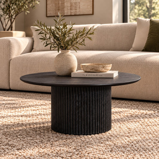 Helmsley Wood Coffee Table, in black, shown in a luxe lounge set up. | Coffee tables, round coffee tables, wood coffee table, coffee tables for sale 