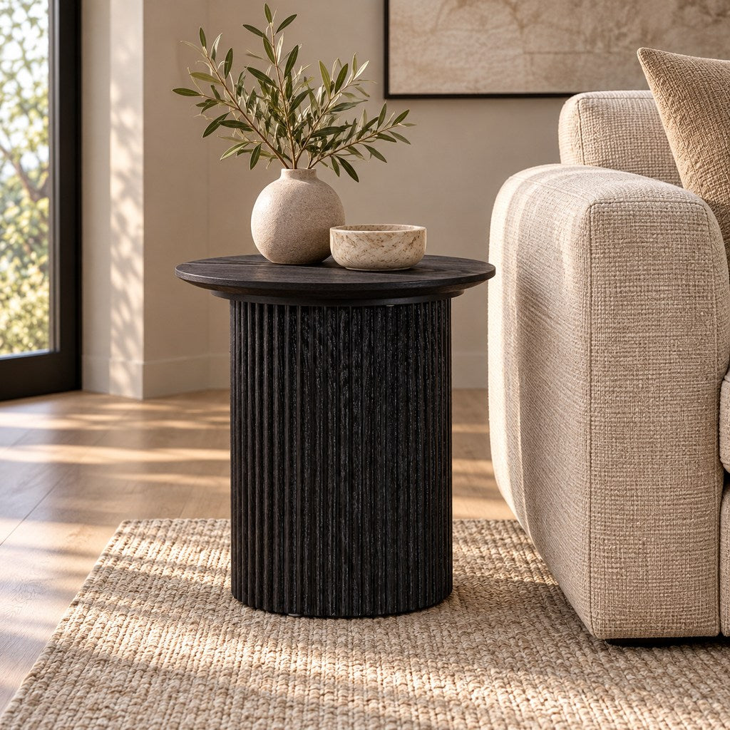 Helmsley Coffee Table, an elegant black, round wood coffee table shown in a chic lounge interior. | coffee tables, coffee tables for sale, round coffee tables 