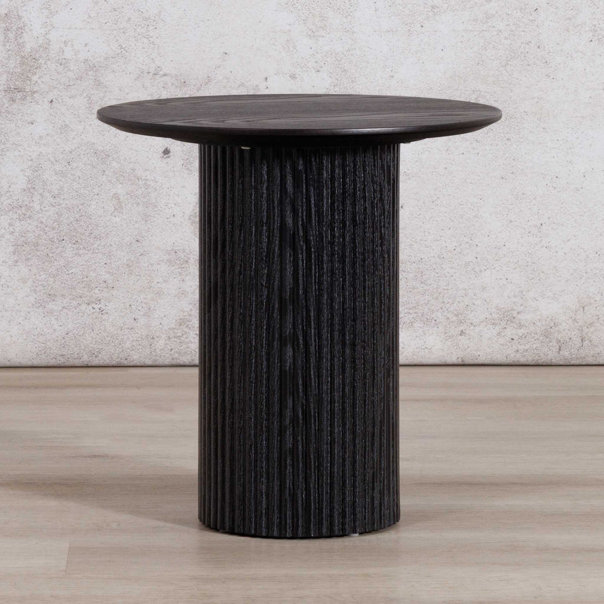 Helmsley Coffee table in a rich black hue, shown as an accent piece in a stylish living room. | Coffee tables, coffee tables for sale, round coffee table, wood coffee table 