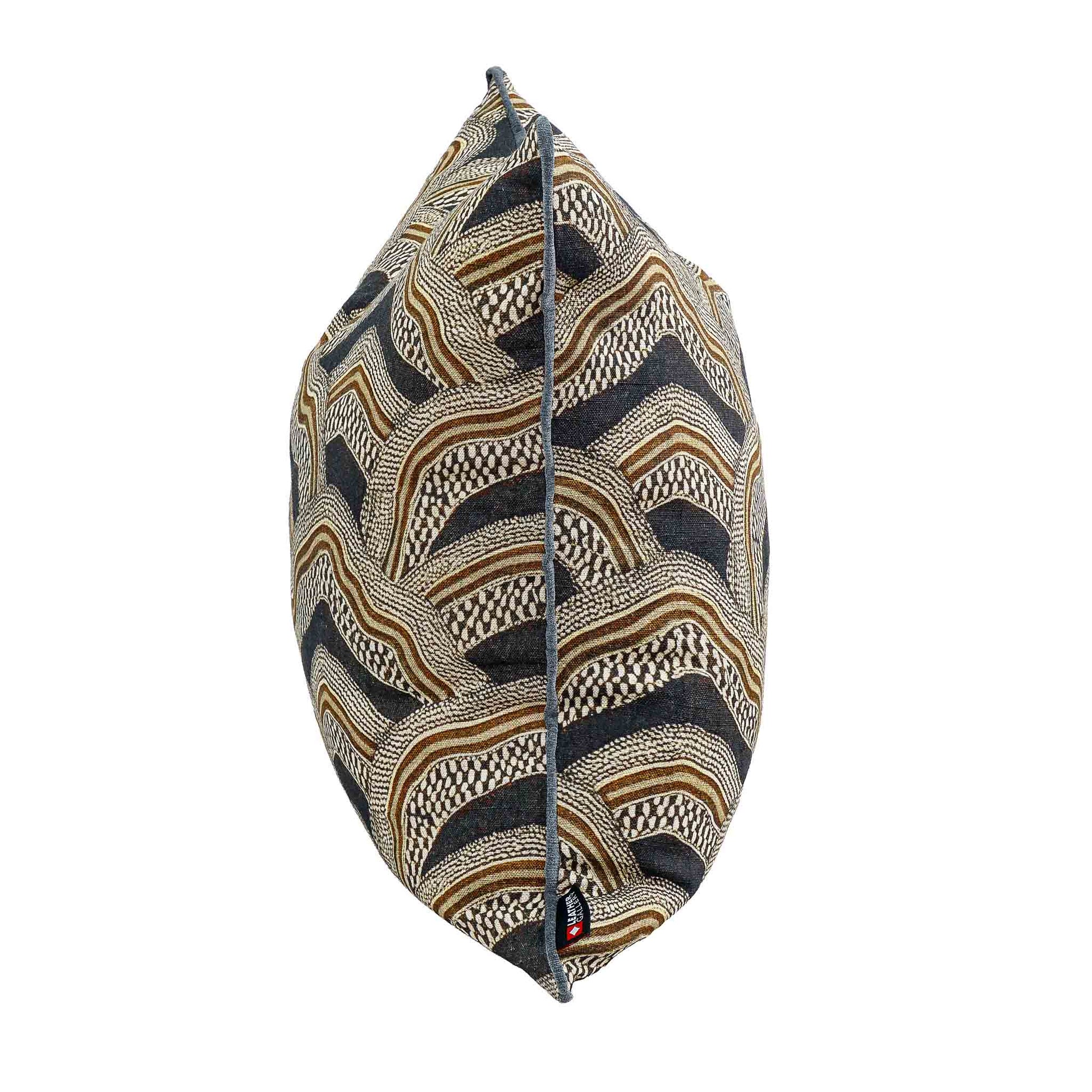 Leather Gallery Imperial Partridge Cushion in Volcanic Ash, featuring a geometric wave pattern with dark piping.