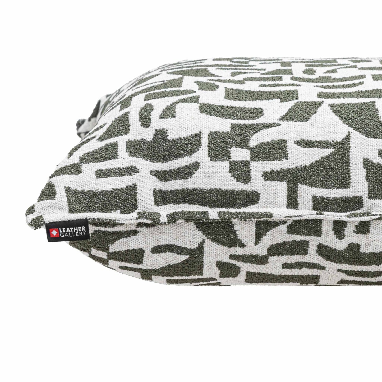 Leather Gallery Krait Cushion in Mediterranean Olive, featuring a geometric woven pattern and branded Leather Gallery tag.