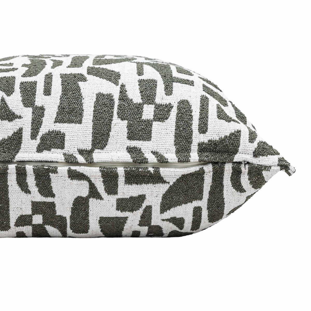 Close-up of the Leather Gallery Krait Cushion in Mediterranean Olive, showing the abstract geometric woven pattern in olive green and off-white.
