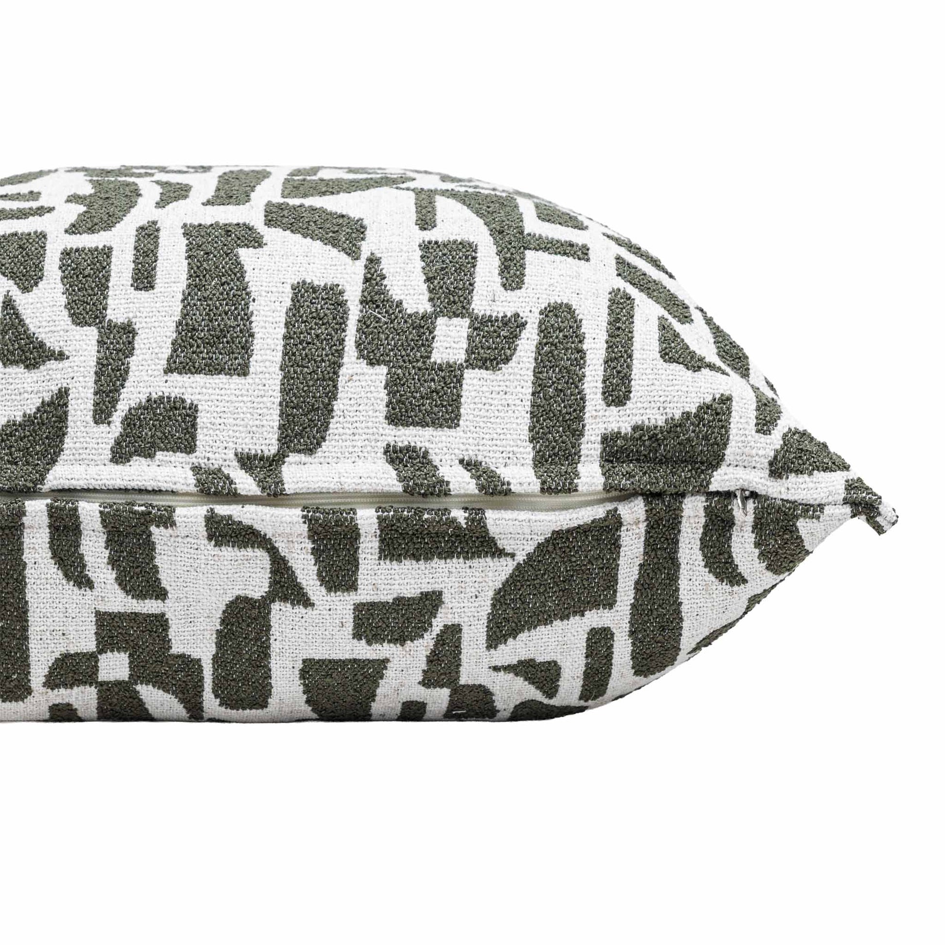 Close-up of the Leather Gallery Krait Cushion in Mediterranean Olive, showing the abstract geometric woven pattern in olive green and off-white.