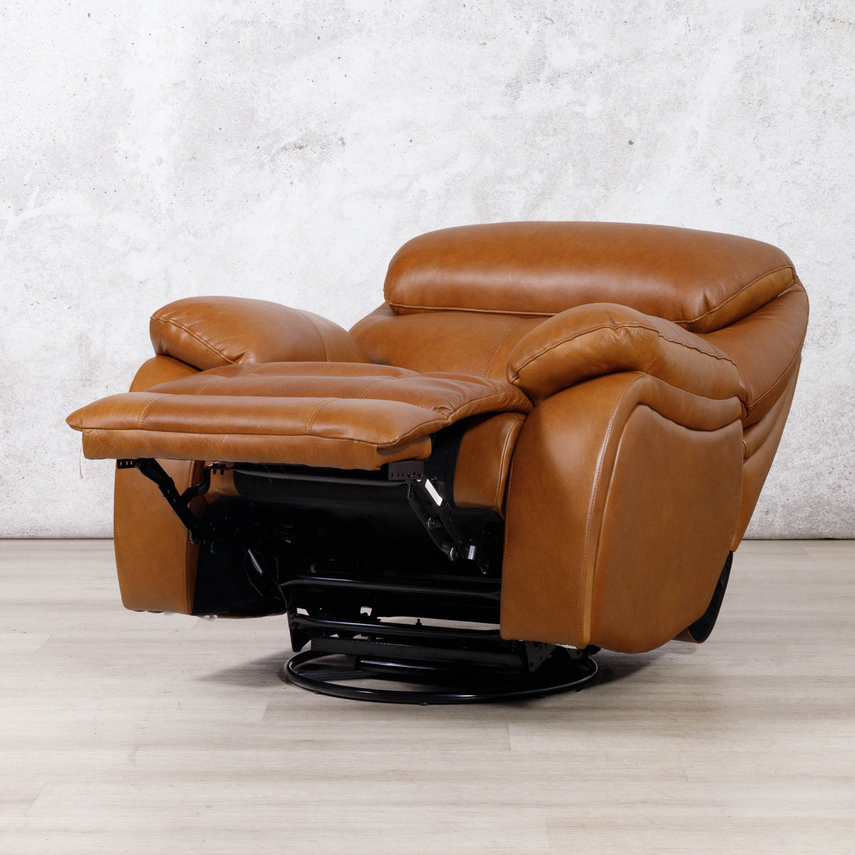 Leather Gallery Kuta 1 Seater Leather Recliner in Czar Pecan, shown with the footrest extended on a black swivel base.