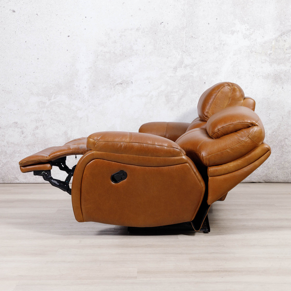 Side view of the Leather Gallery Kuta 3 Seater Leather Recliner in Czar Pecan, shown fully reclined with the footrest and headrest extended.