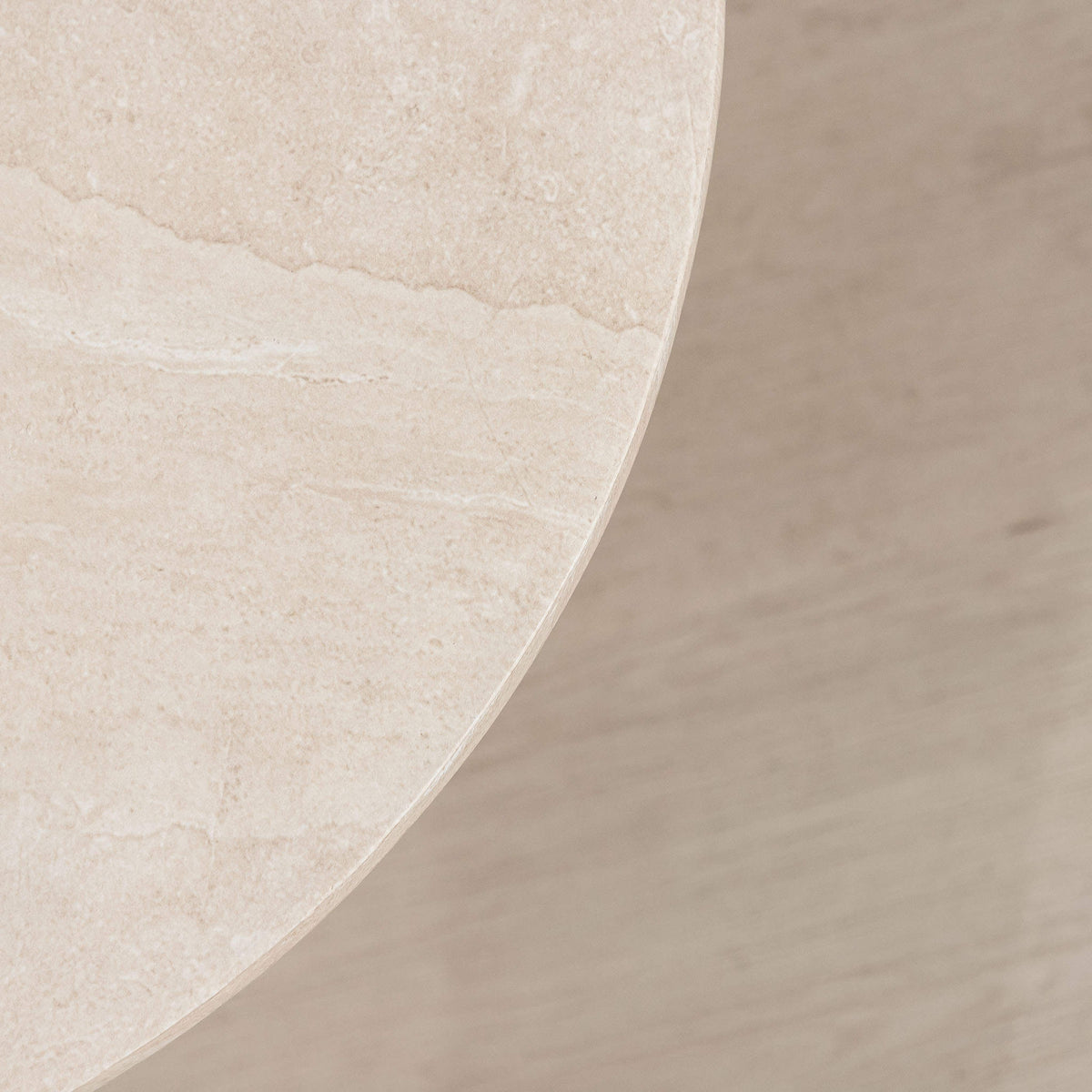 Gallery Everyday Maison Coffee Table in Lunar Quartz, featuring a round marble-look top styled in a modern living room.