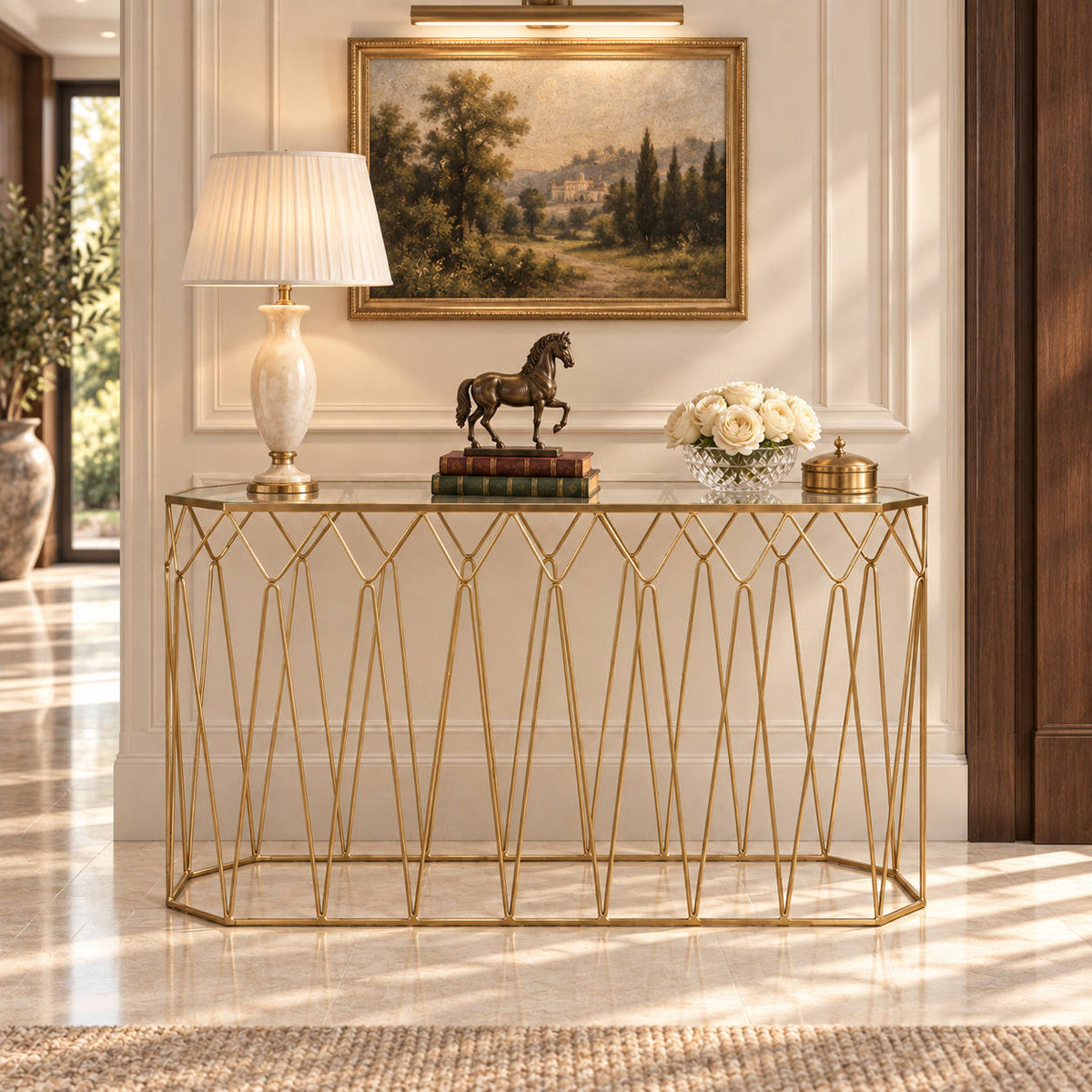 Leather Gallery Mara Gold Server, featuring a gold wire frame and clear glass top styled with elegant décor.