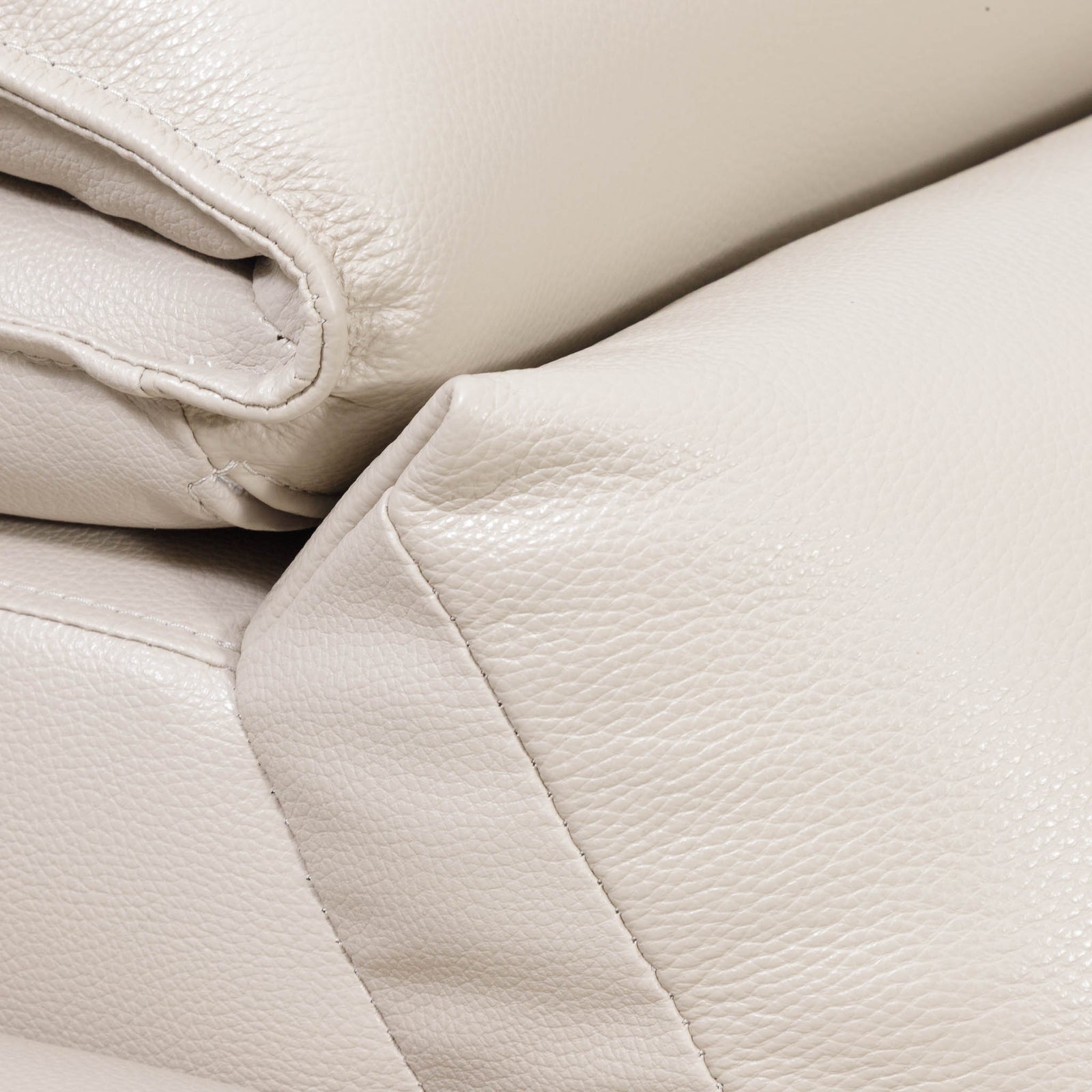 Close-up of the Leather Gallery Marbella 5 Seater Leather L Shape Couch in Cream Beige, showing pebbled leather texture and stitching detail.