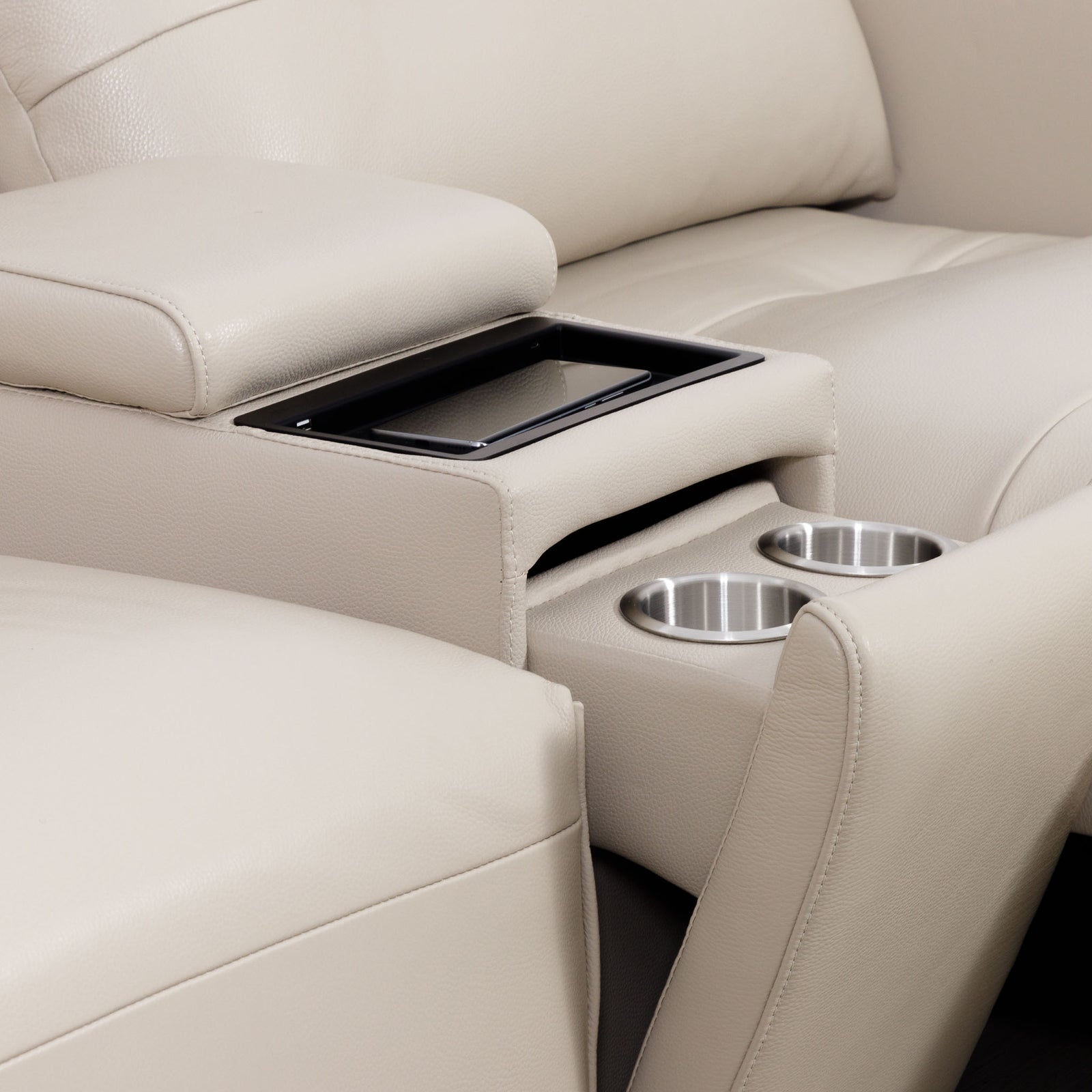 Close-up of the Leather Gallery Marbella 5 Seater Leather L Shape Couch in Cream Beige, showing the centre console with tray table and two stainless steel cup holders.