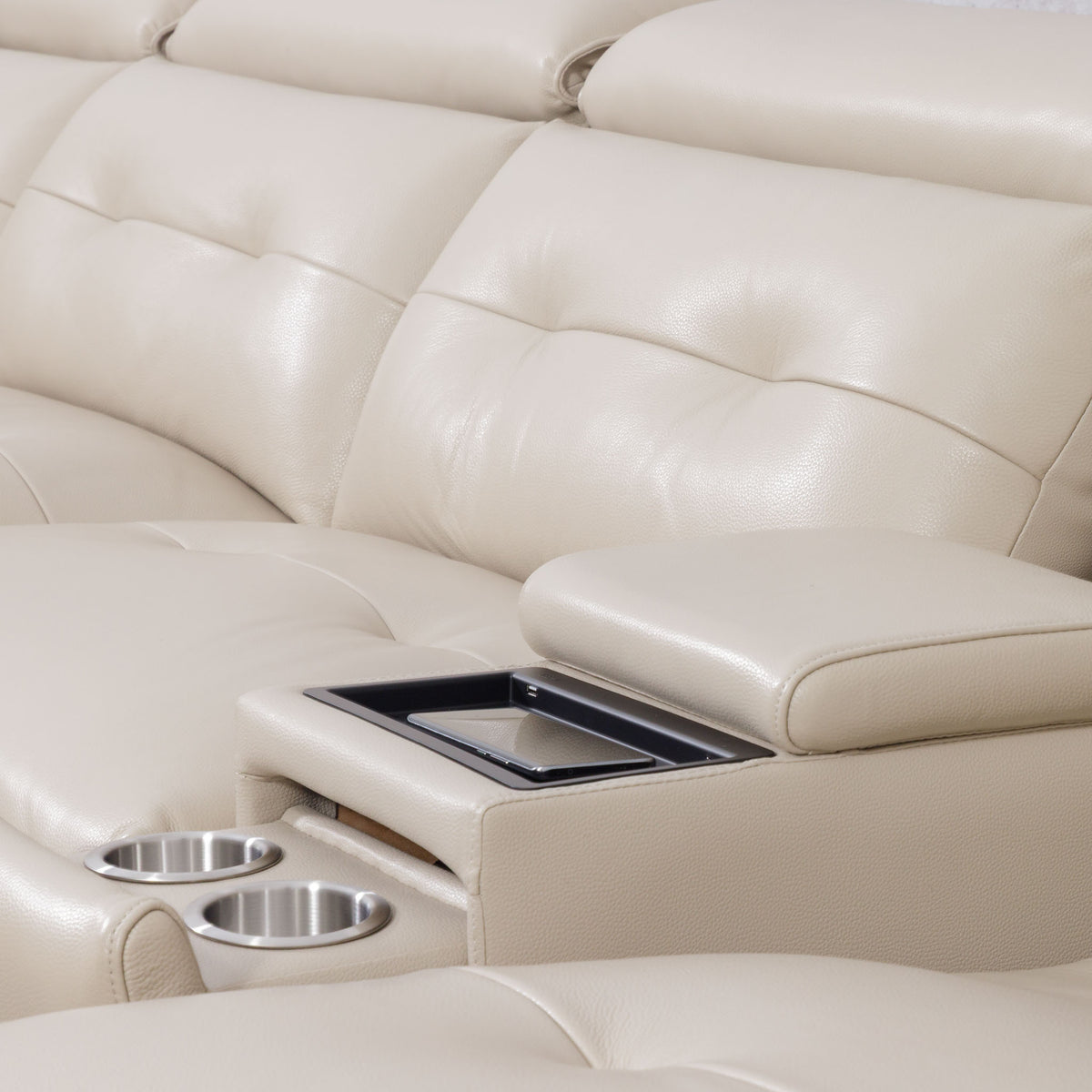 Close-up of the Leather Gallery Marbella 5 Seater Leather L Shape Couch in Cream Beige, featuring tufted cushions, a centre armrest, tray table, and two stainless steel cup holders.