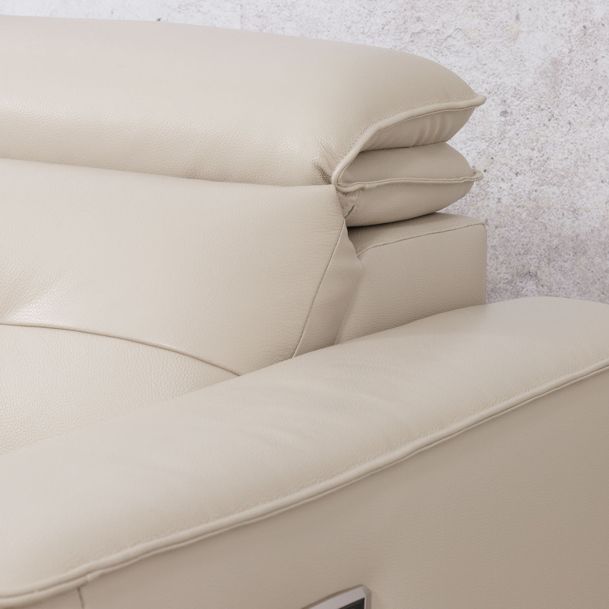 Close-up of the Leather Gallery Marbella 5 Seater Leather L Shape Couch in Cream Beige, showing the armrest, backrest cushion, and smooth leather upholstery.