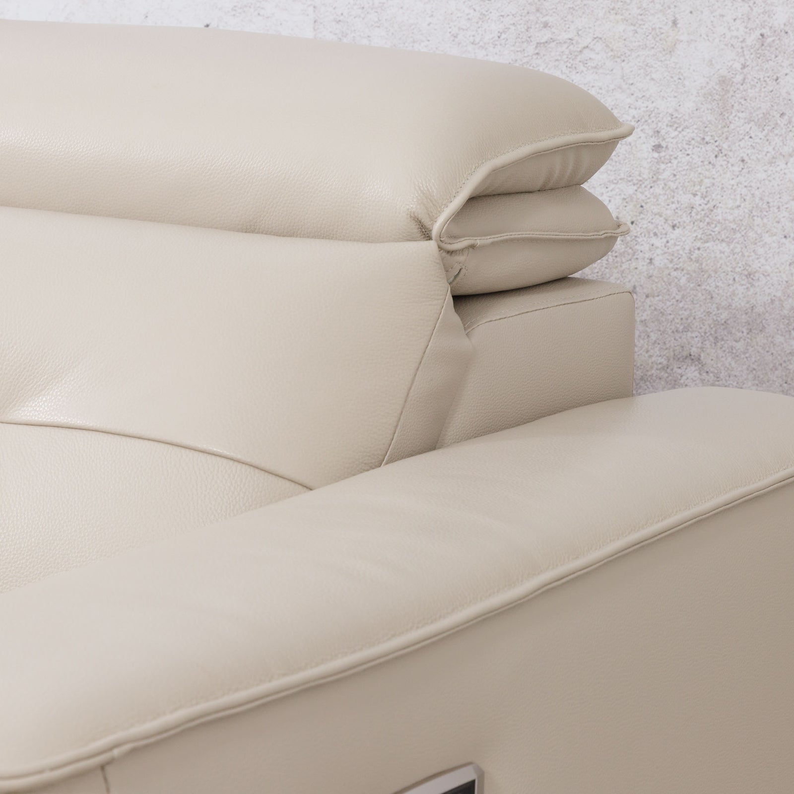 Close-up of the Leather Gallery Marbella 5 Seater Leather L Shape Couch in Cream Beige, showing the armrest, backrest cushion, and smooth leather upholstery.
