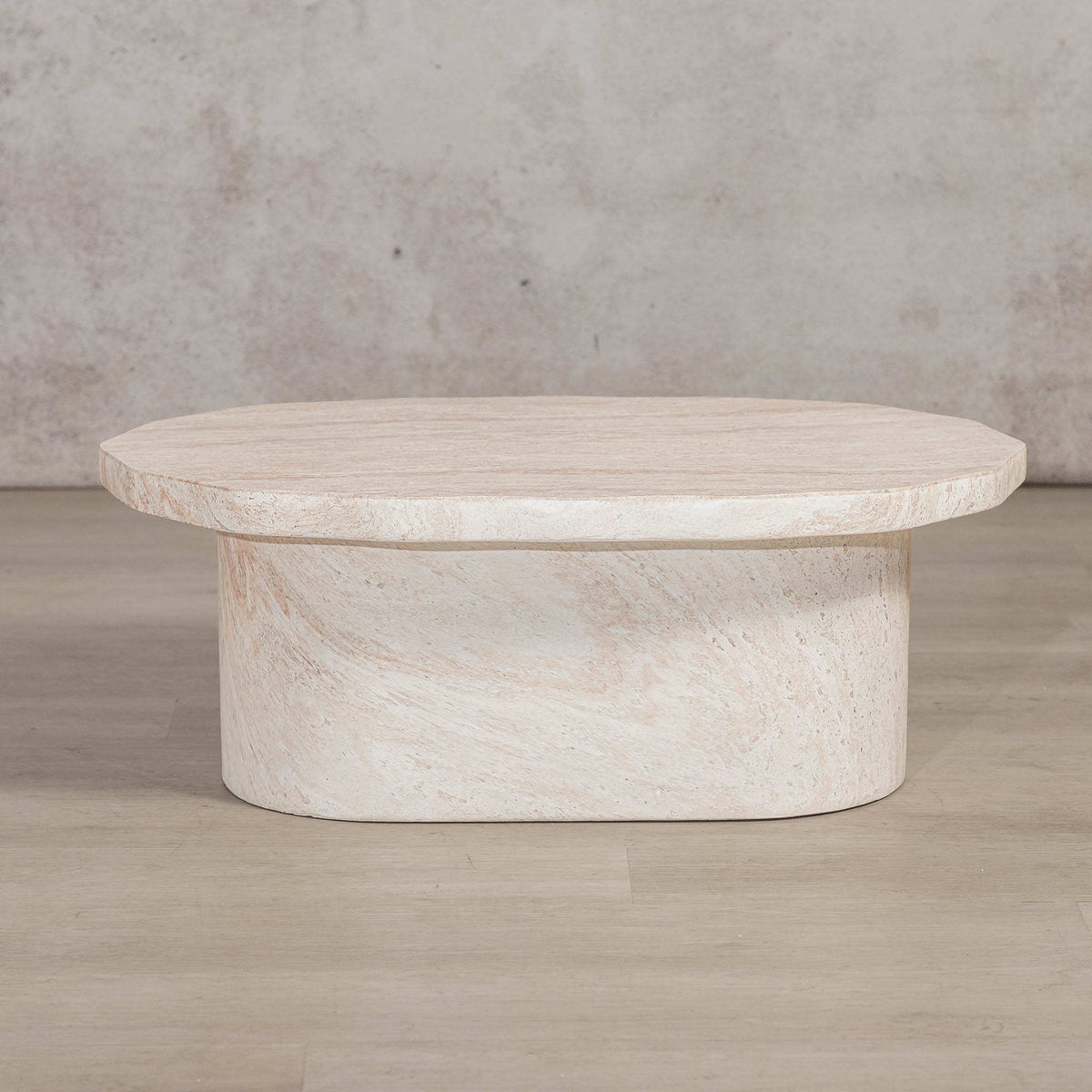 Gallery Everyday Marea Coffee Table in Seashell, featuring a round stone design with a warm beige travertine-look finish.