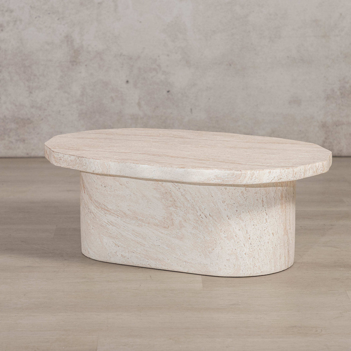 Gallery Everyday Marea Coffee Table in Seashell, featuring a round stone design with a warm beige travertine-look finish.
