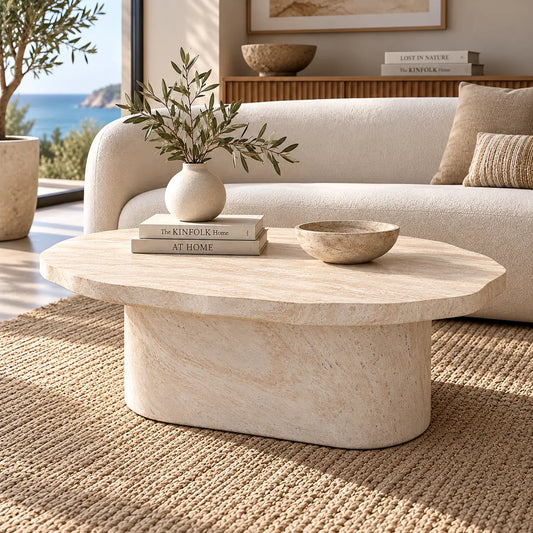 Gallery Everyday Marea Coffee Table in Seashell, featuring a round stone design with a warm beige travertine-look finish.