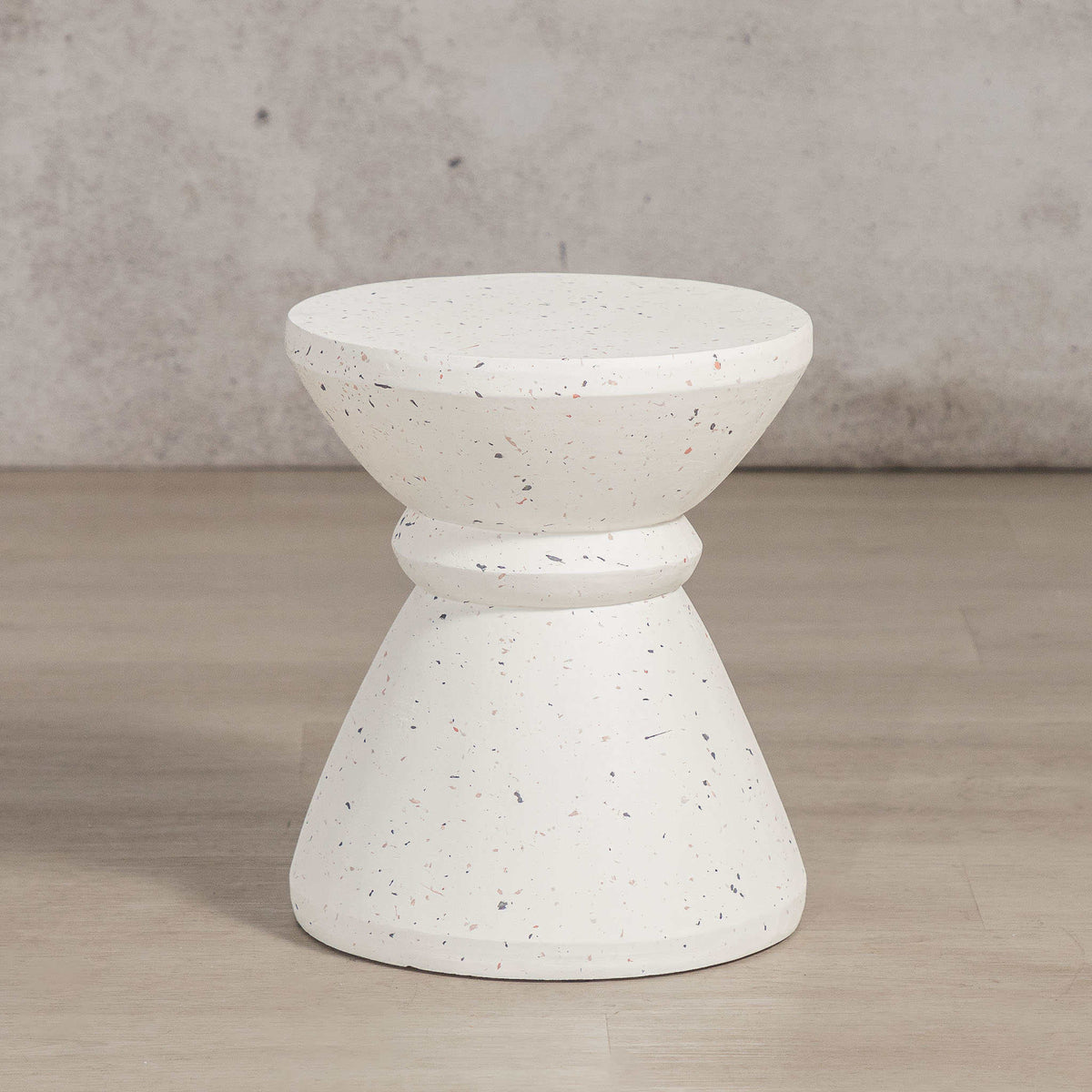 Gallery Everyday Marielle Side Table in Stone, featuring a round concrete design with a speckled beige finish.