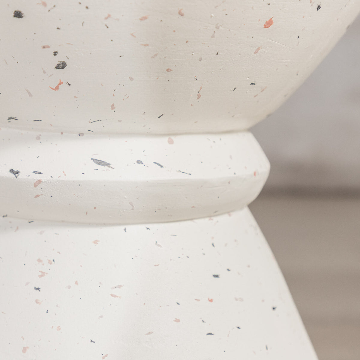 Gallery Everyday Marielle Side Table in Stone, featuring a round concrete design with a speckled beige finish.