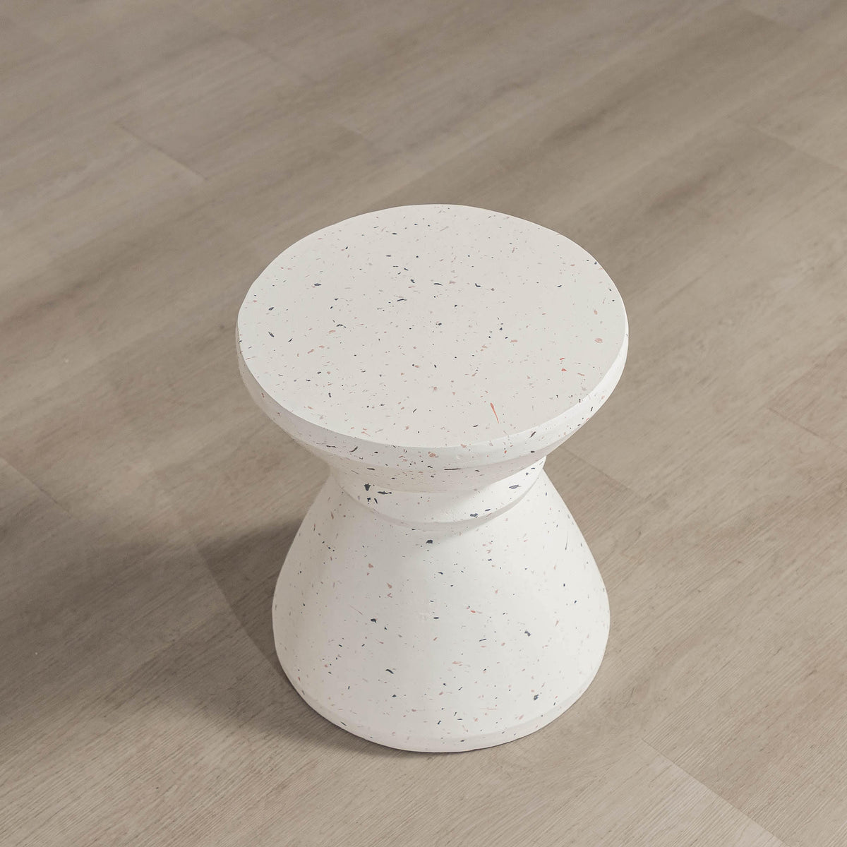 Gallery Everyday Marielle Side Table in Stone, featuring a round concrete design with a speckled beige finish.