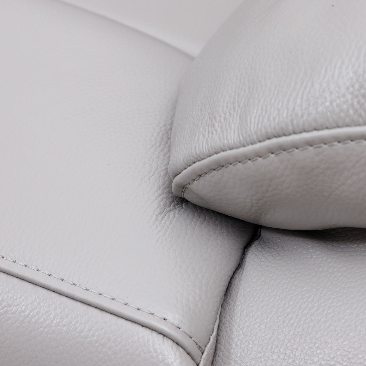 Close-up of the Leather Gallery Marino 1 Seater Leather Recliner in Luxe Grey, showing the pebbled leather texture and armrest stitching.