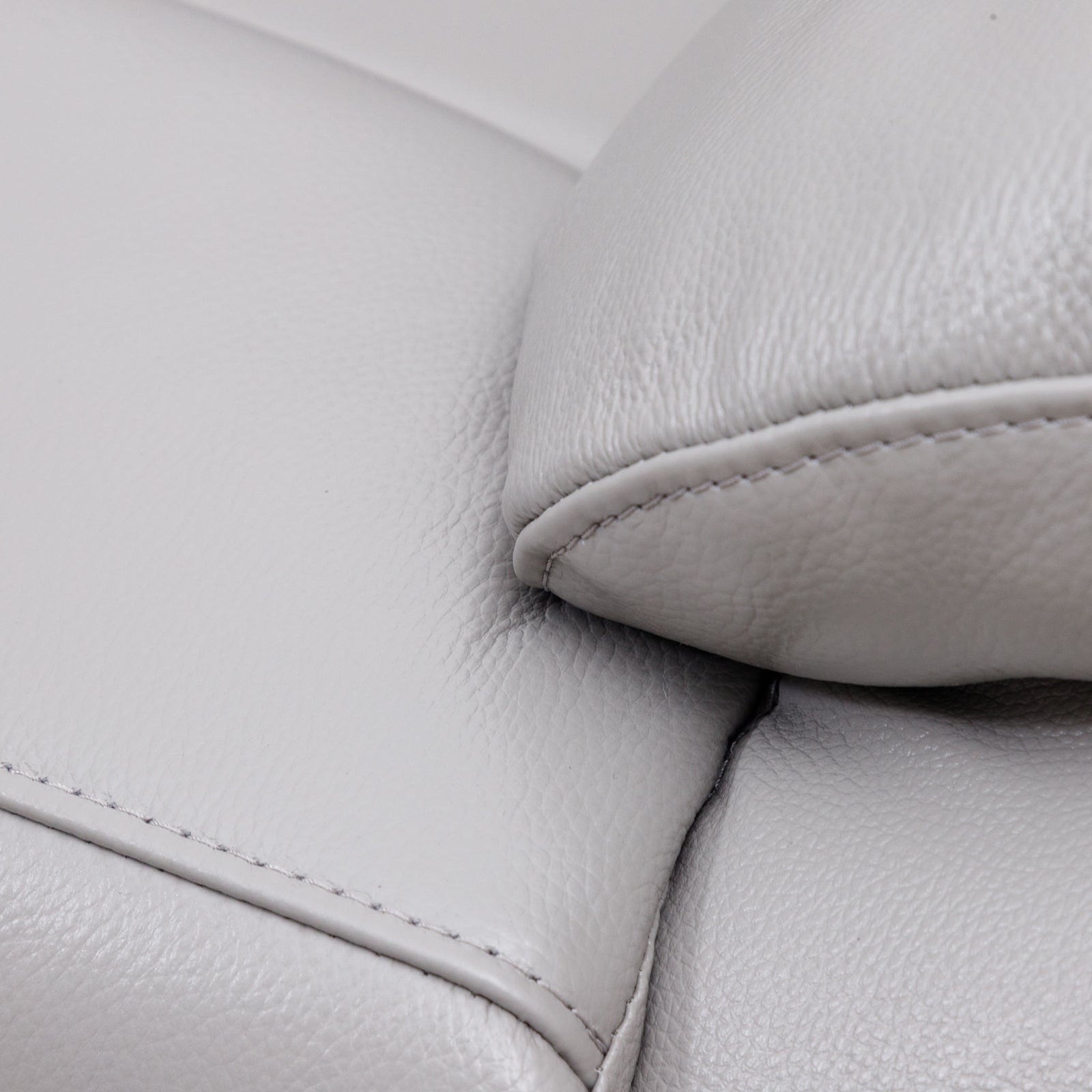 Close-up of the Leather Gallery Marino 1 Seater Leather Recliner in Luxe Grey, showing the pebbled leather texture and armrest stitching.
