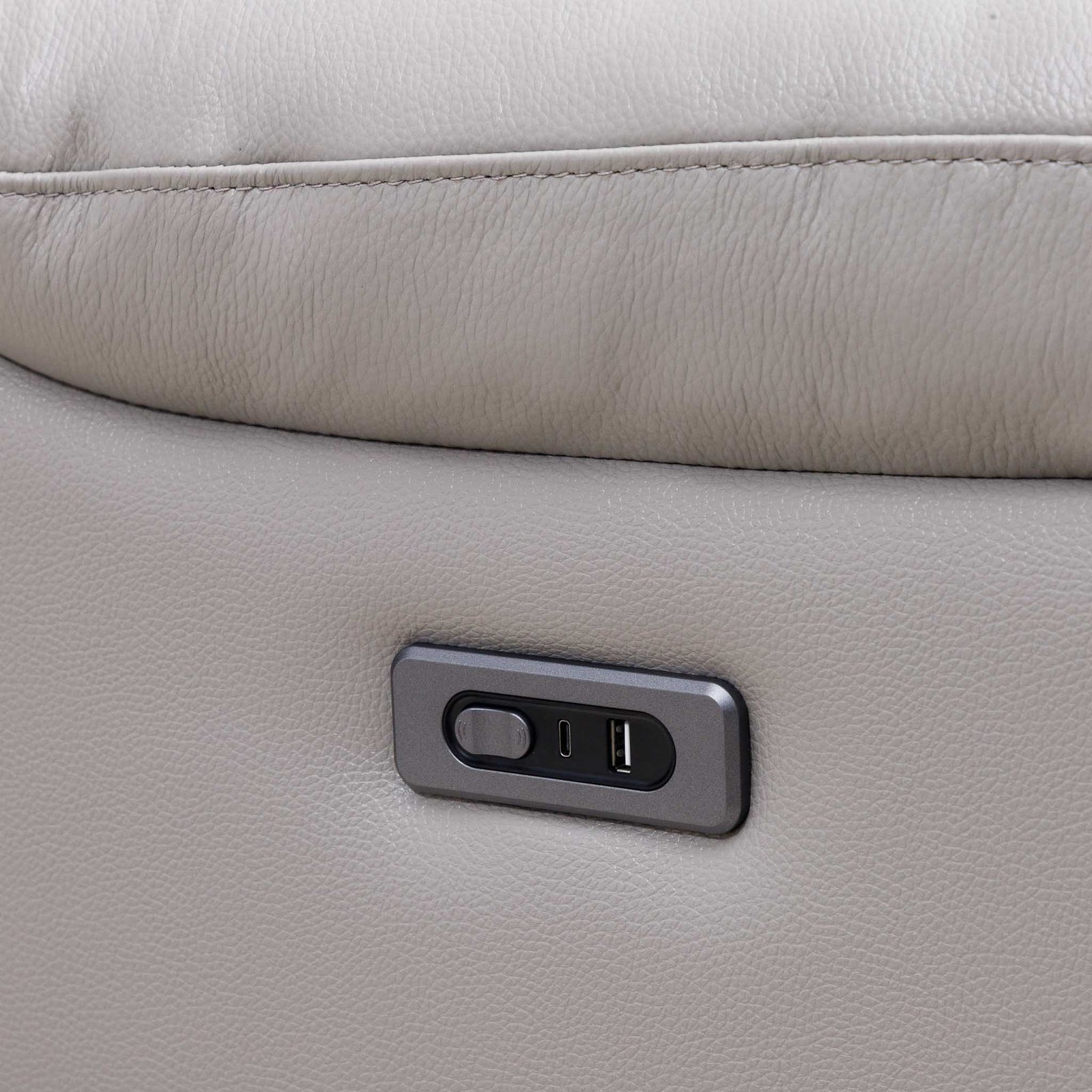 Close-up of the Leather Gallery Marino 1 Seater Leather Recliner in Luxe Grey, showing the built-in power controls and USB charging port.