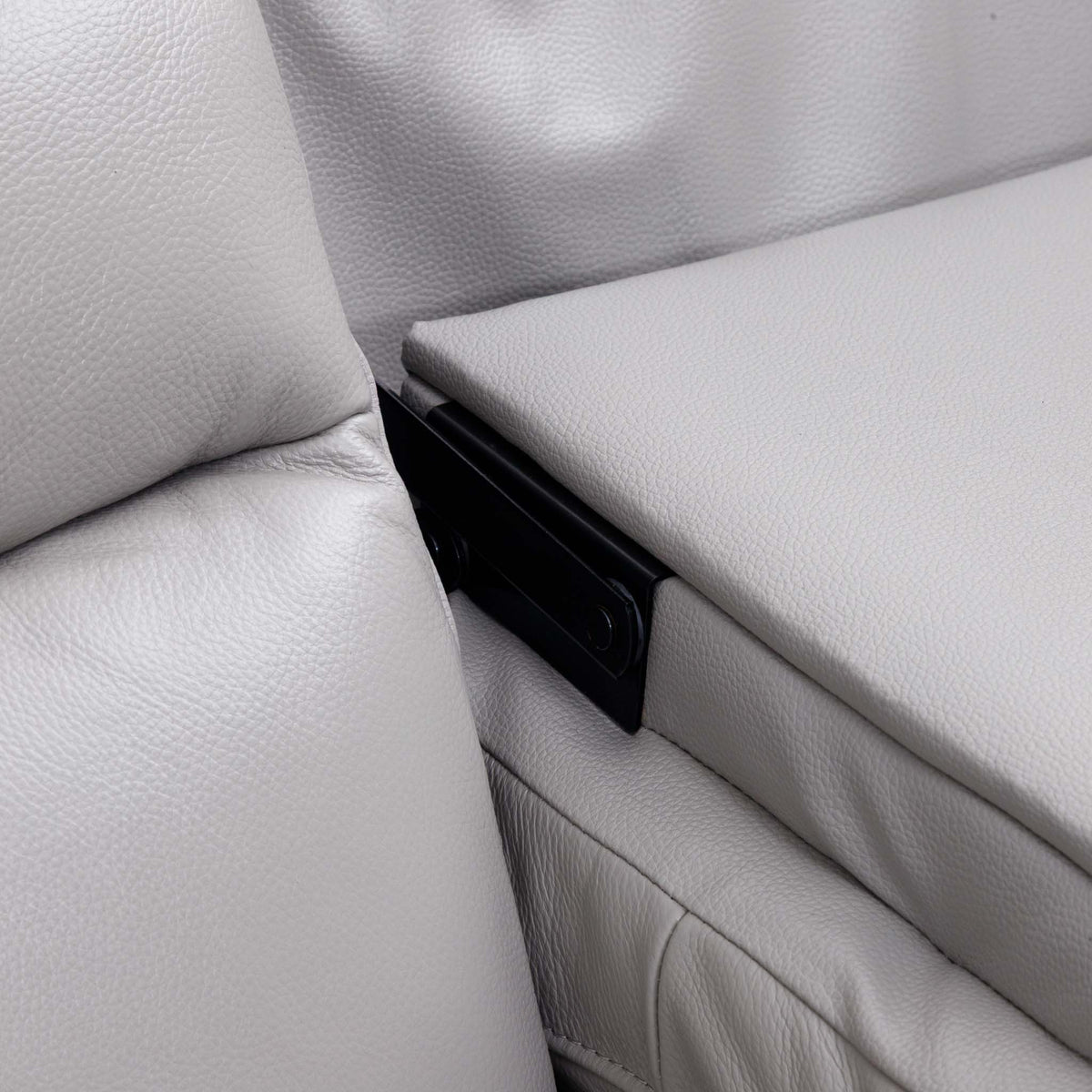 Close-up of the Leather Gallery Marino 3 Seater Leather Recliner in Luxe Grey, showing pebbled leather and the black armrest support bracket.