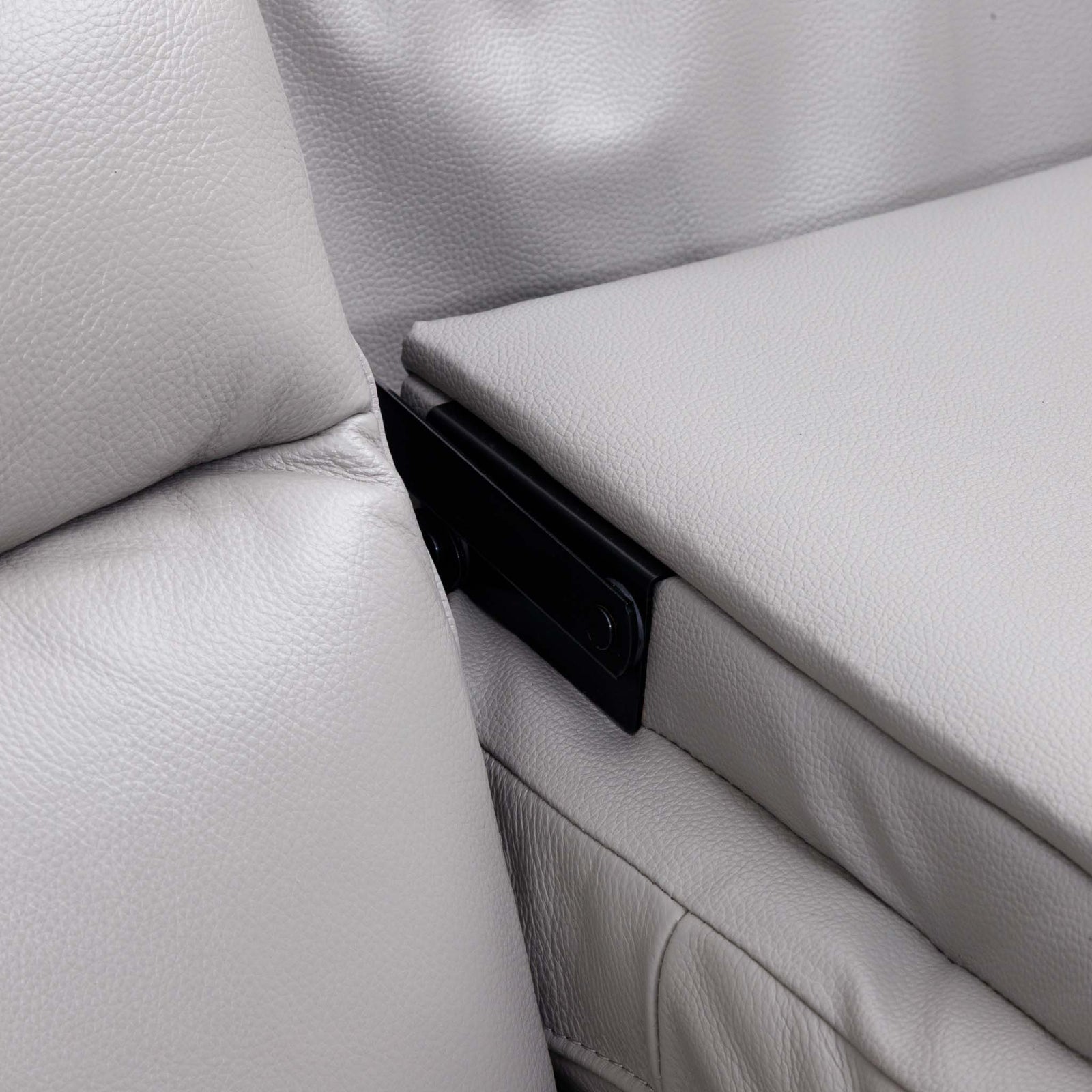 Close-up of the Leather Gallery Marino 3 Seater Leather Recliner in Luxe Grey, showing pebbled leather and the black armrest support bracket.