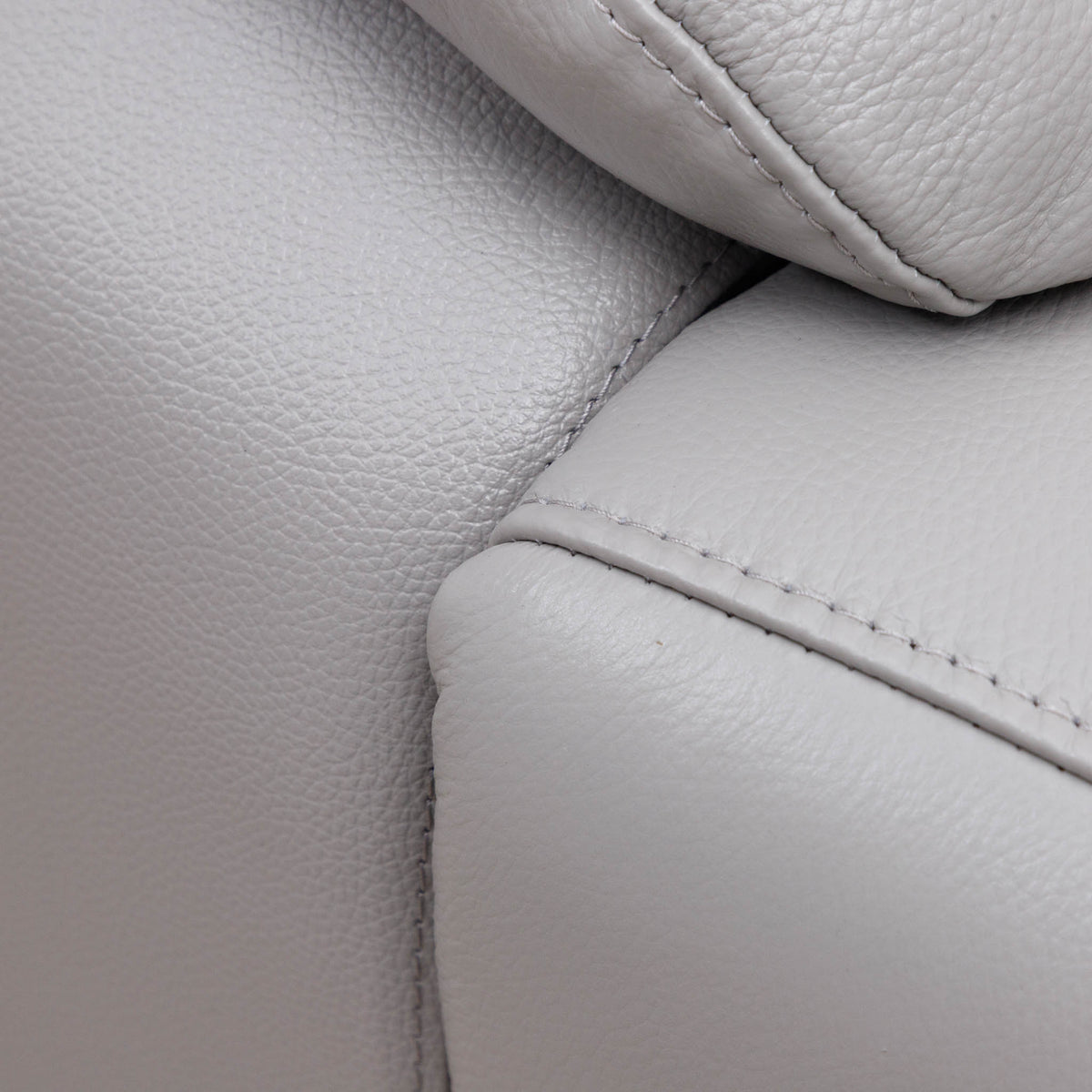 Close-up of the Leather Gallery Marino 3 Seater Leather Recliner in Luxe Grey, showing pebbled leather, visible stitching, and cushion detail.