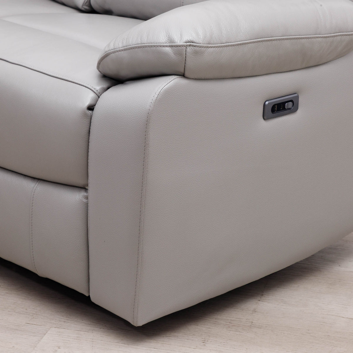 Close-up of the Leather Gallery Marino 3 Seater Leather Recliner in Luxe Grey, showing the side control panel and upholstered corner.