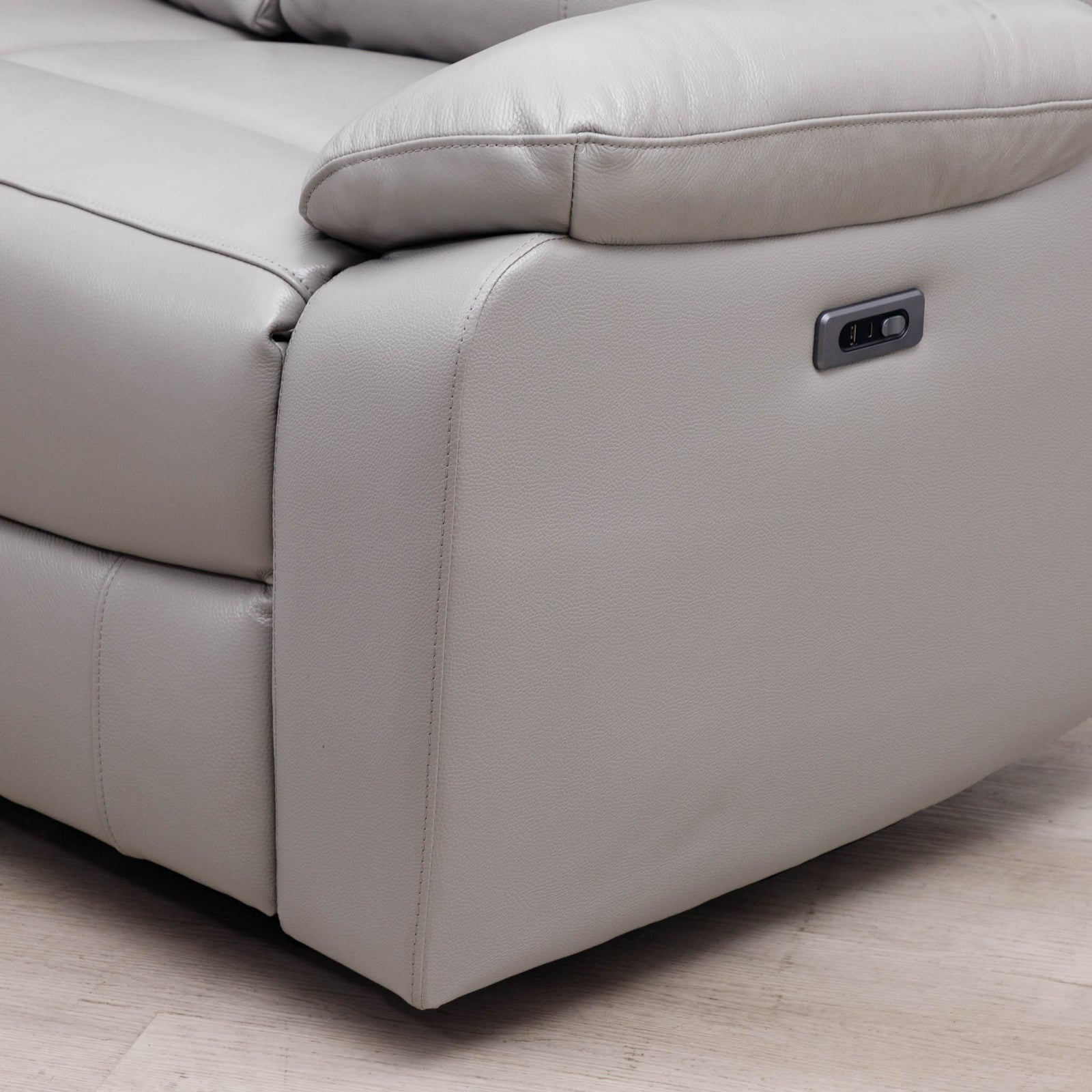 Close-up of the Leather Gallery Marino 3 Seater Leather Recliner in Luxe Grey, showing the side control panel and upholstered corner.
