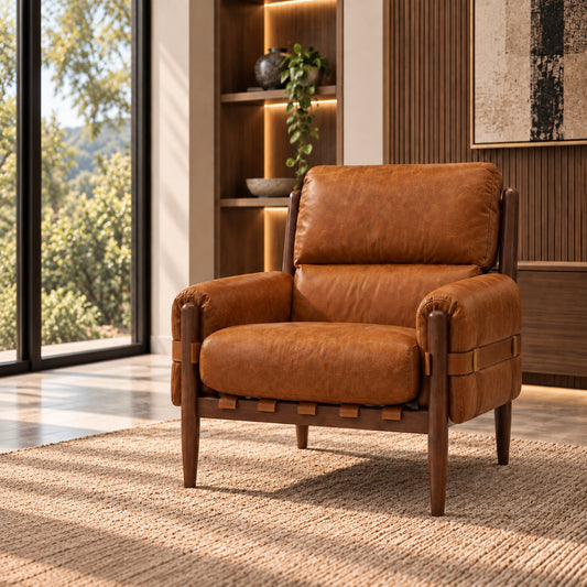Stattera Orsello Leather Armchair in Deep Russet, featuring warm leather upholstery, a dark wood frame, and leather strap detailing.
